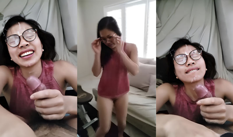 The bespectacled girl loves having cum on her face